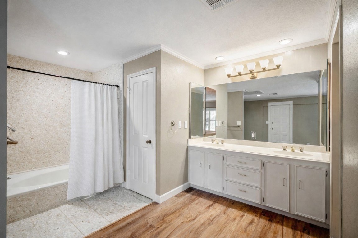 1306 Riverview Court Houston, TX 77077 - Photo 23 of 43 a bathroom with a double vanity sink and mirror