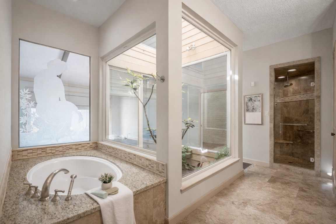 1306 Riverview Court Houston, TX 77077 - Photo 26 of 43 a bathroom with a tub and shower