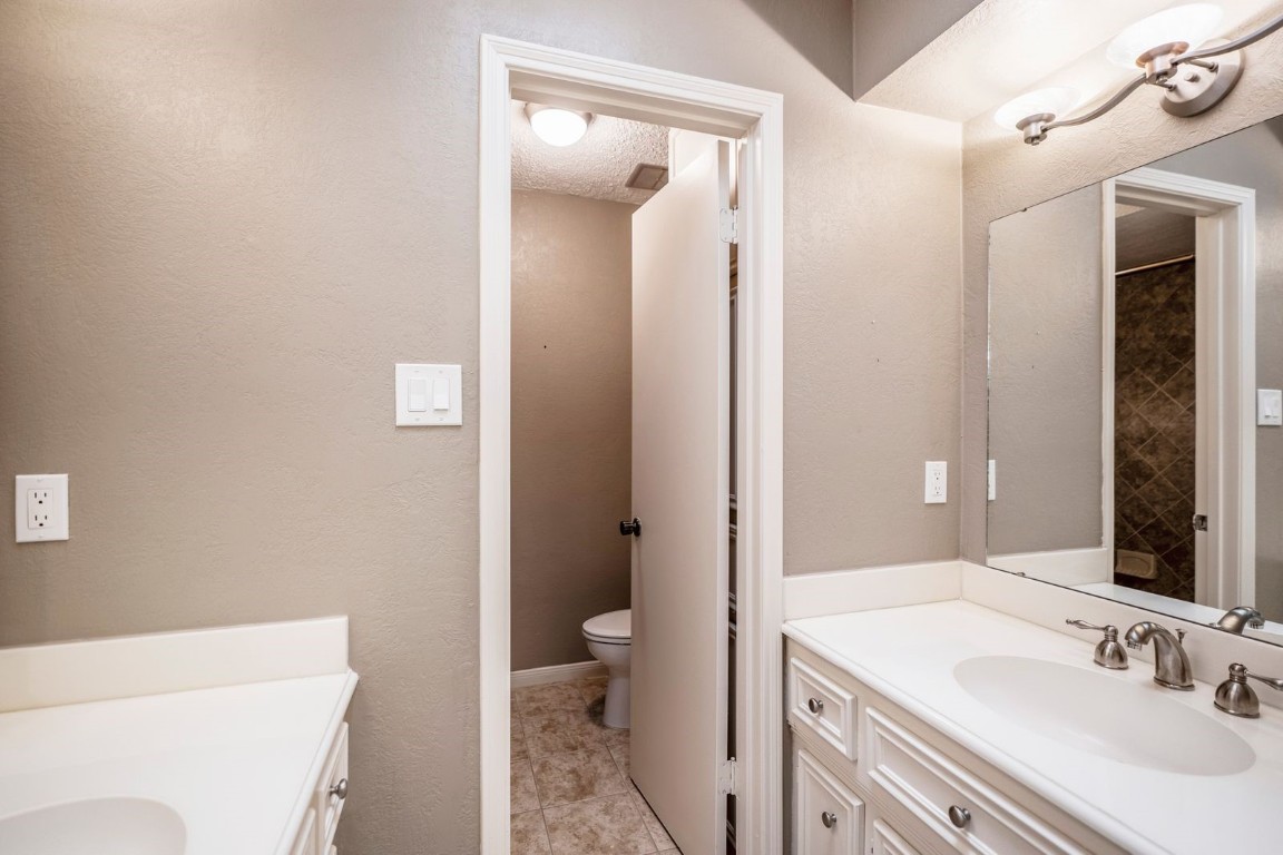 1306 Riverview Court Houston, TX 77077 - Photo 30 of 43 a bathroom with a sink a toilet and shower