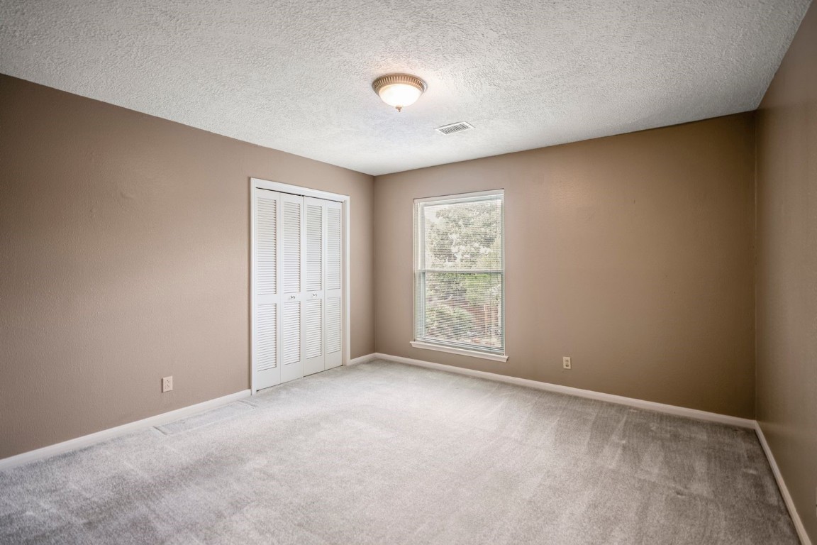 1306 Riverview Court Houston, TX 77077 - Photo 31 of 43 an empty room with a empty space and a window