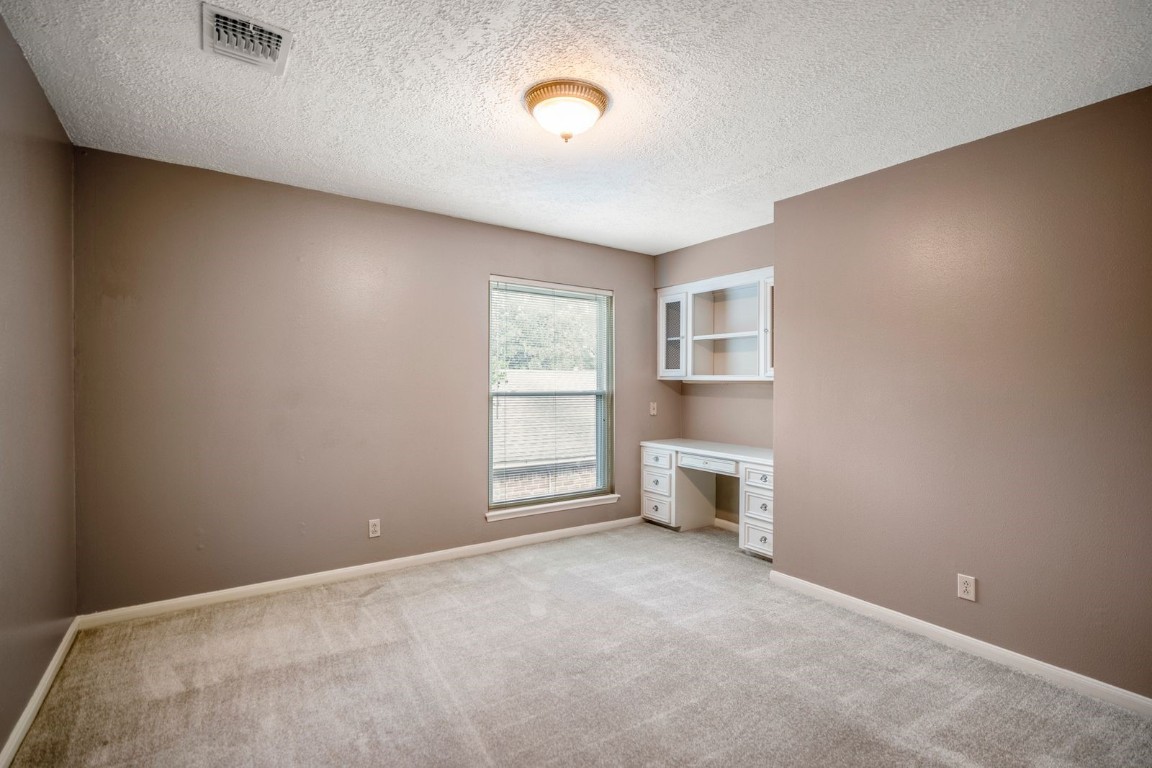 1306 Riverview Court Houston, TX 77077 - Photo 32 of 43 a view of a room with wooden floor and windows