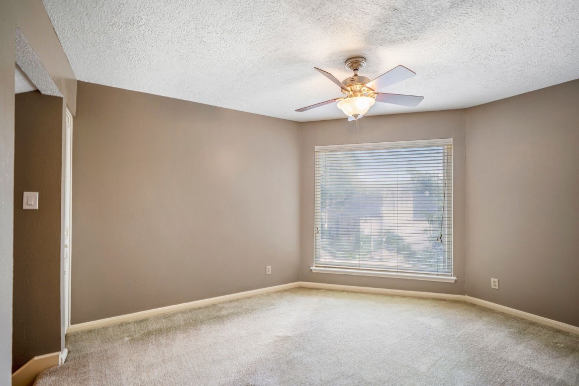 1306 Riverview Court Houston, TX 77077 - Photo 33 of 43 an empty room with windows and fan