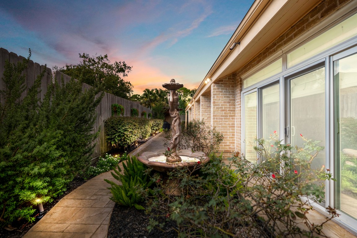 1306 Riverview Court Houston, TX 77077 - Photo 39 of 43 a backyard of a house with outdoor seating and green space