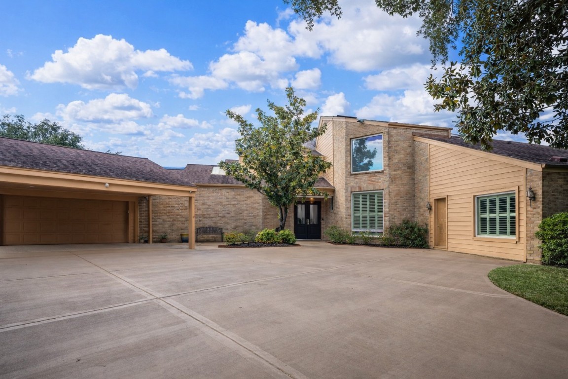 1306 Riverview Court Houston, TX 77077 - Photo 42 of 43 a view of a house with a backyard