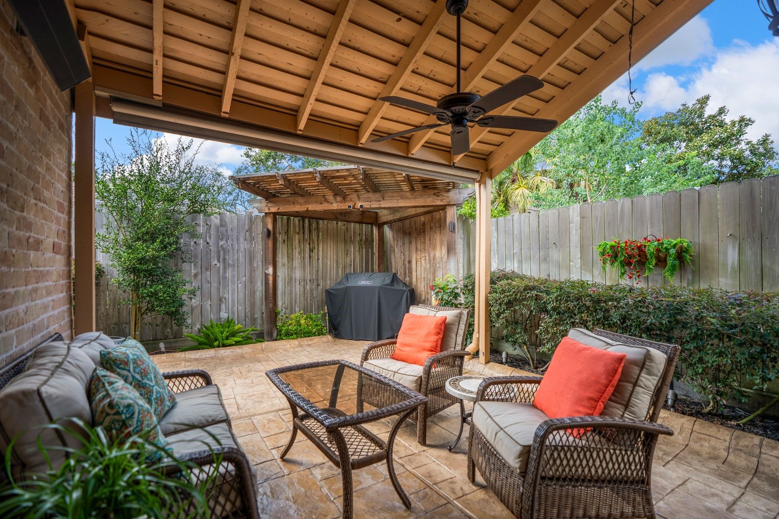 1306 Riverview Court Houston, TX 77077 - Photo 6 of 43 a view of a patio with a table chairs and a small yard
