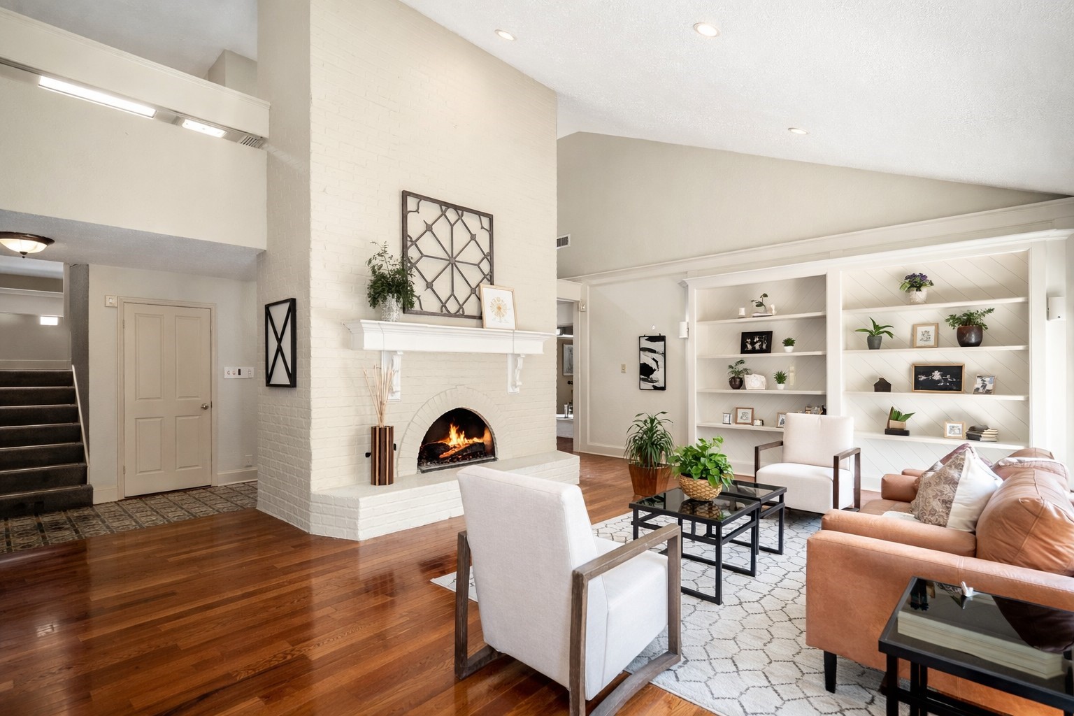 1306 Riverview Court Houston, TX 77077 - Photo 9 of 43 a living room with furniture and a fireplace