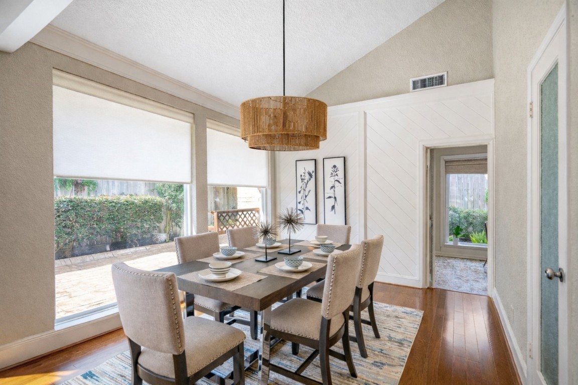 1306 Riverview Court Houston, TX 77077 - Photo 10 of 43 a view of a dining room with furniture window and wooden floor