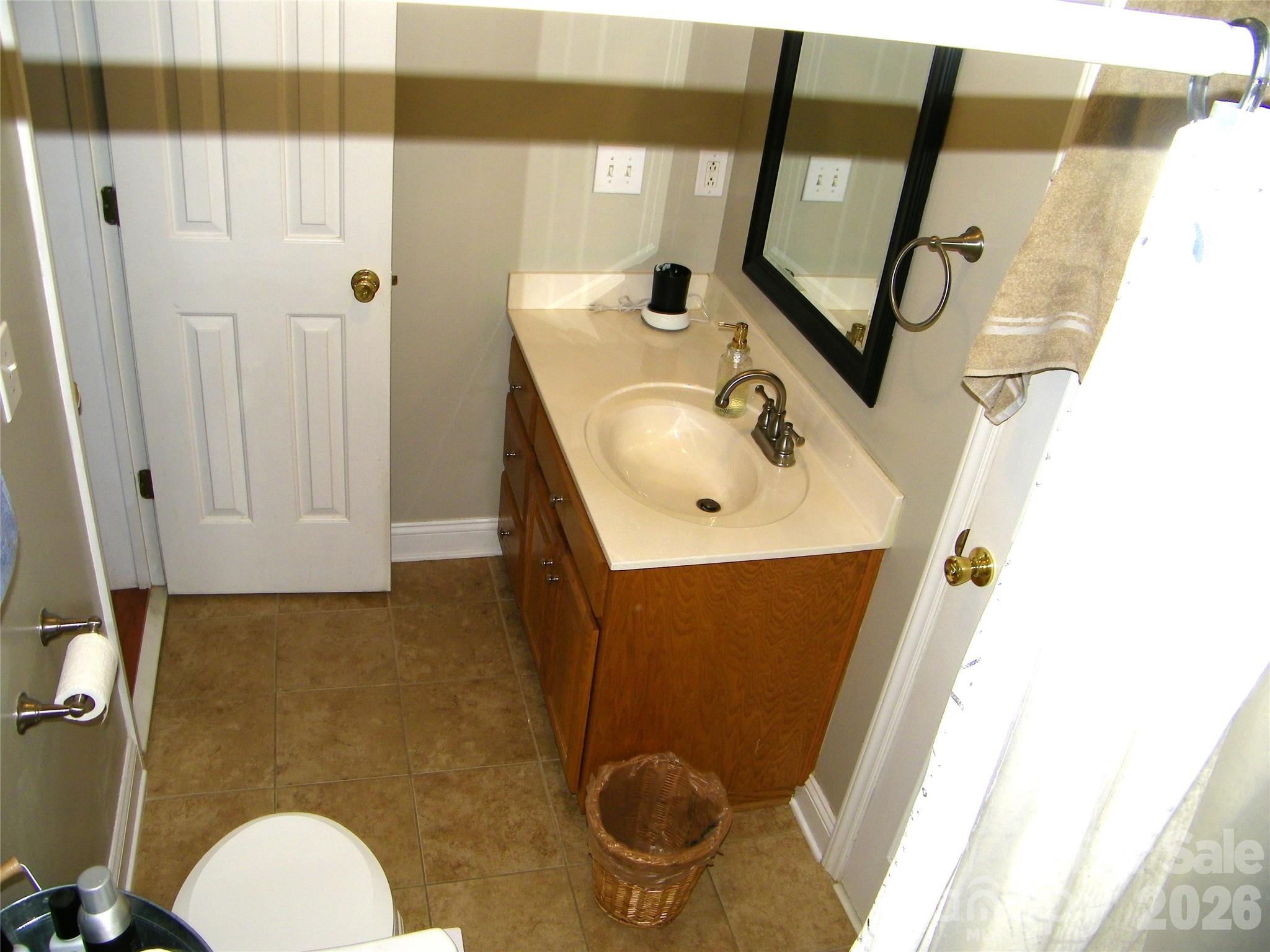 609 Redah Avenue Locust, NC 28097 - Photo 23 of 37 a bathroom with a sink toilet and mirror