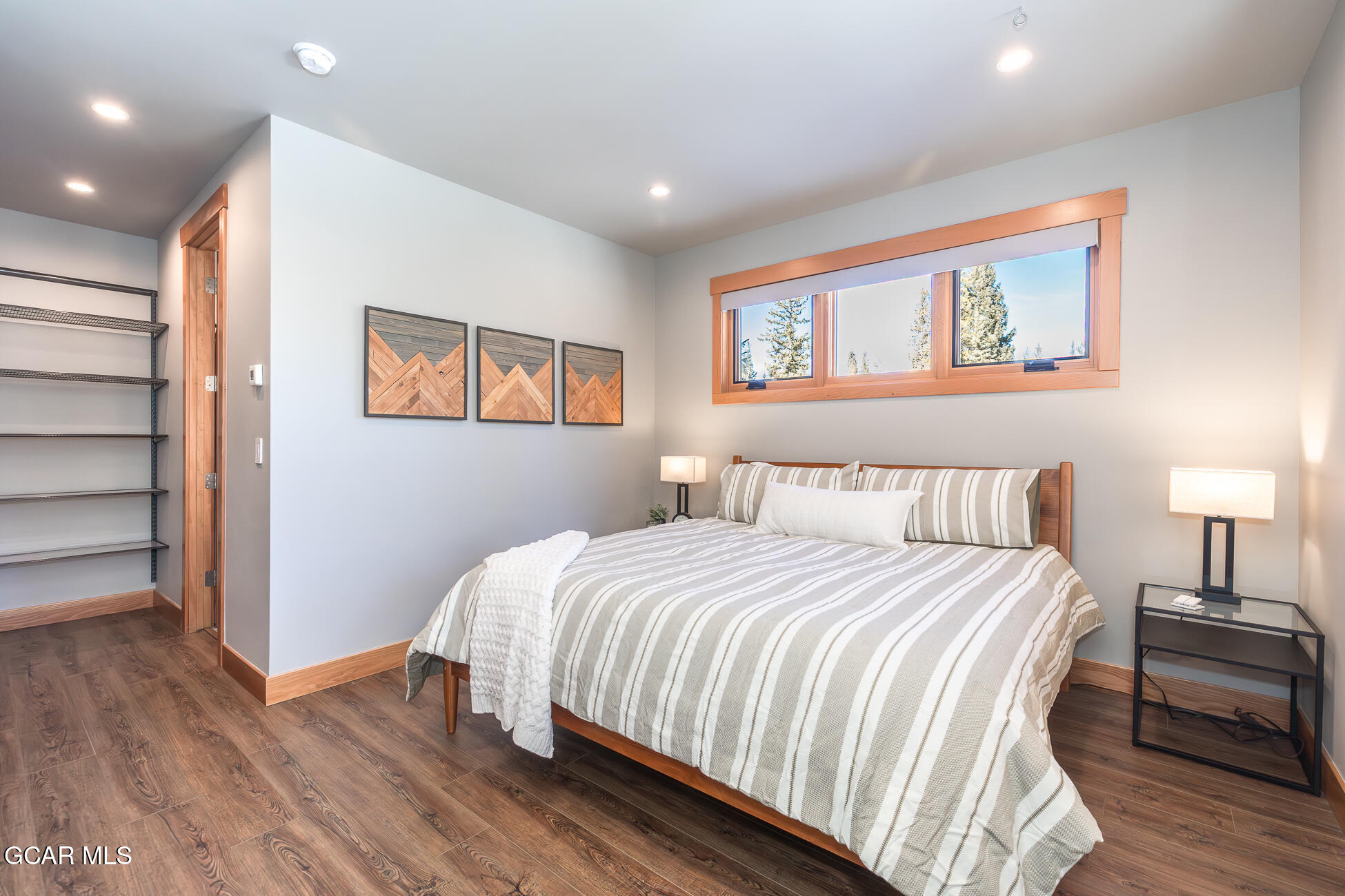 684 Vasquez Road Winter Park, CO 80482 - Photo 26 of 45 a bedroom with a bed and a painting on the wall