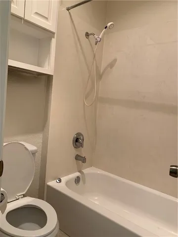 a bathroom with a sink a toilet and a bathtub