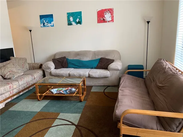 a living room with furniture and a couch