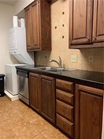 a kitchen with stainless steel appliances granite countertop a sink and cabinets