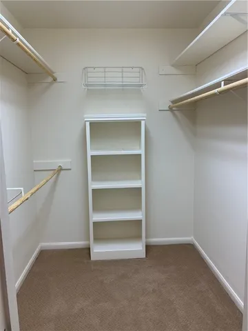 a view of an empty walk in closet
