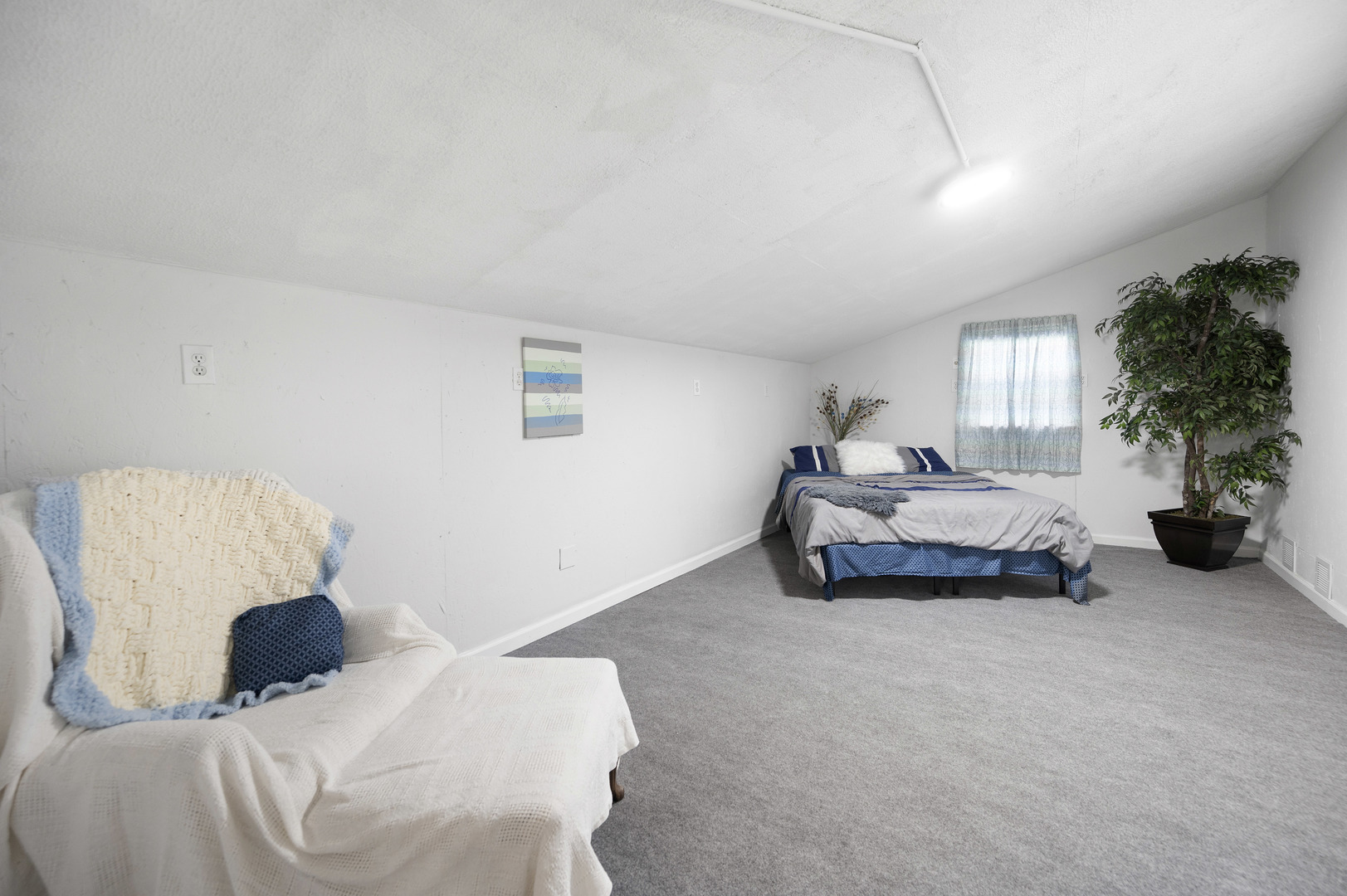 1011 Kohley Road Lisle, IL 60532 - Photo 15 of 26 a bedroom with a bed and a couch