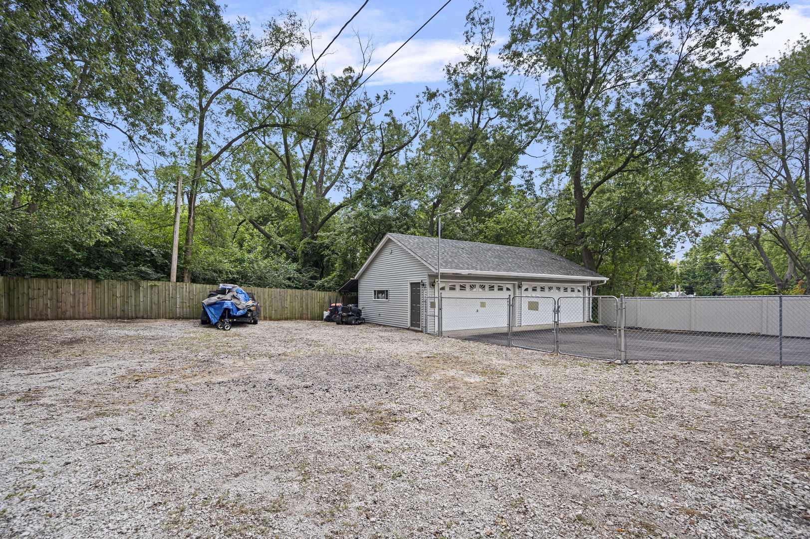 1011 Kohley Road Lisle, IL 60532 - Photo 25 of 26 a view of a house with a yard and large tree