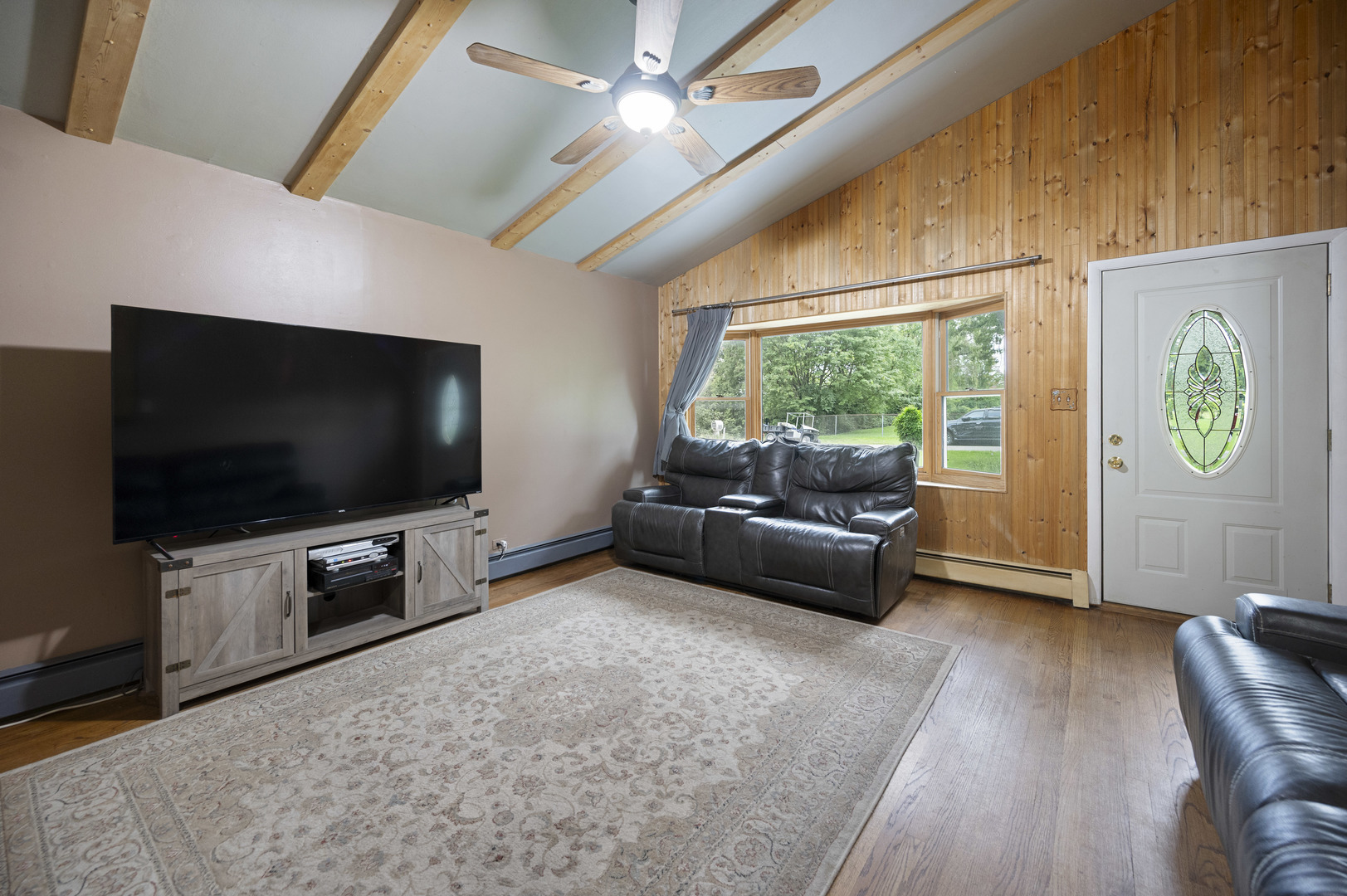1011 Kohley Road Lisle, IL 60532 - Photo 4 of 26 a living room with furniture and a flat screen tv