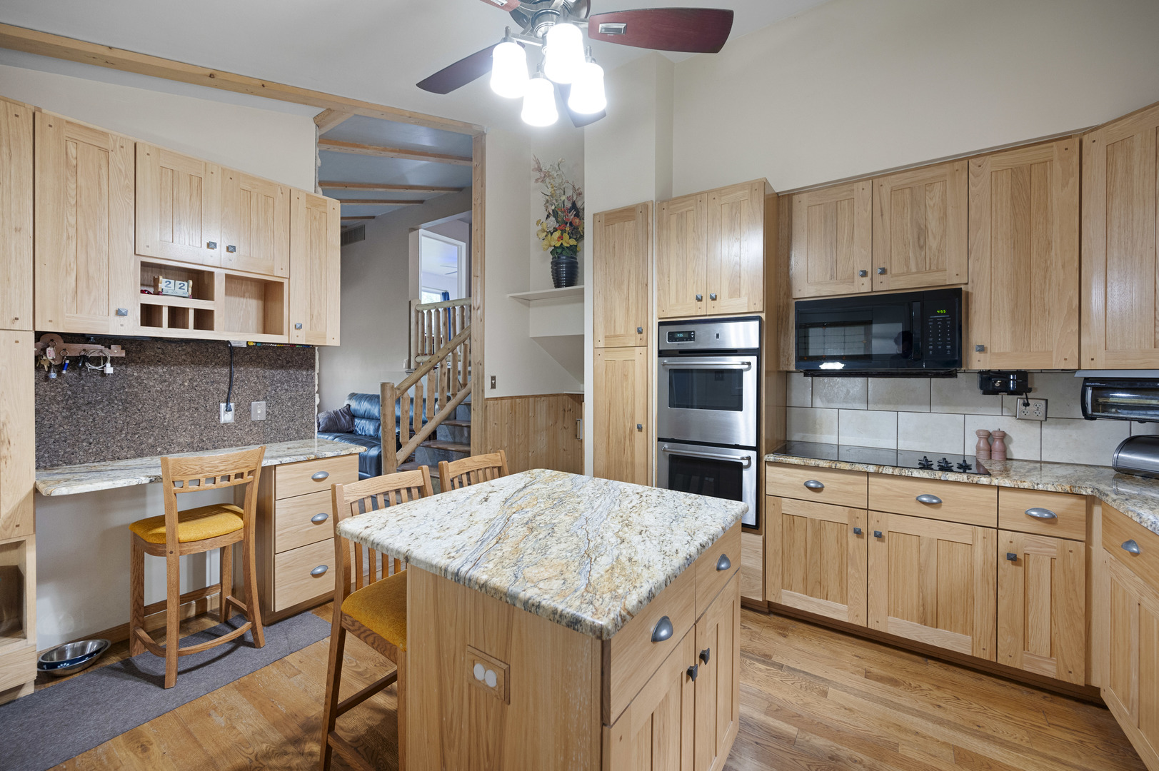 1011 Kohley Road Lisle, IL 60532 - Photo 7 of 26 a kitchen with a sink a microwave and cabinets