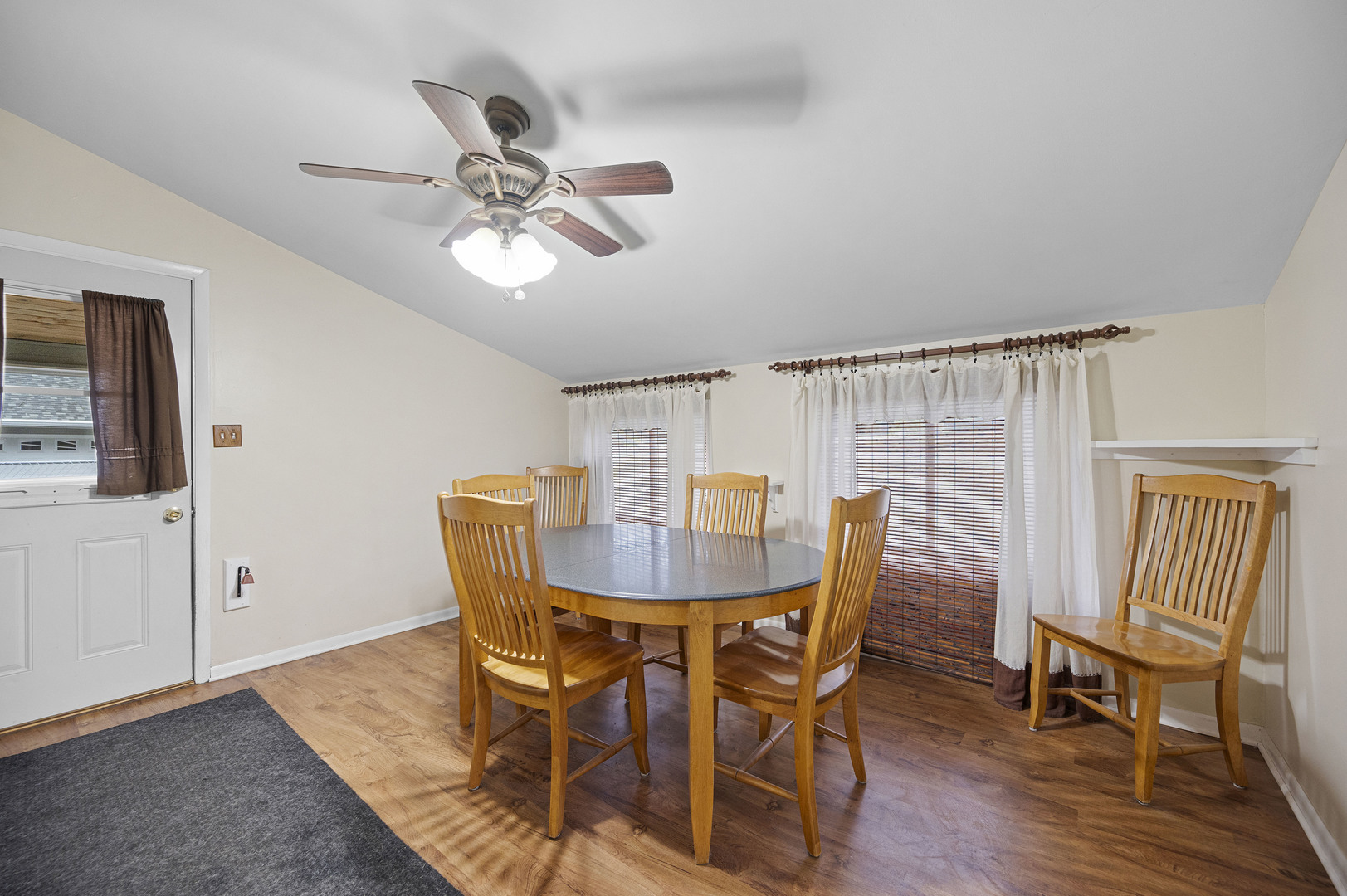 1011 Kohley Road Lisle, IL 60532 - Photo 8 of 26 a view of a dining room with furniture and wooden floor