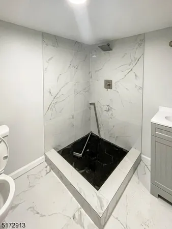 a bathroom with a sink and a toilet