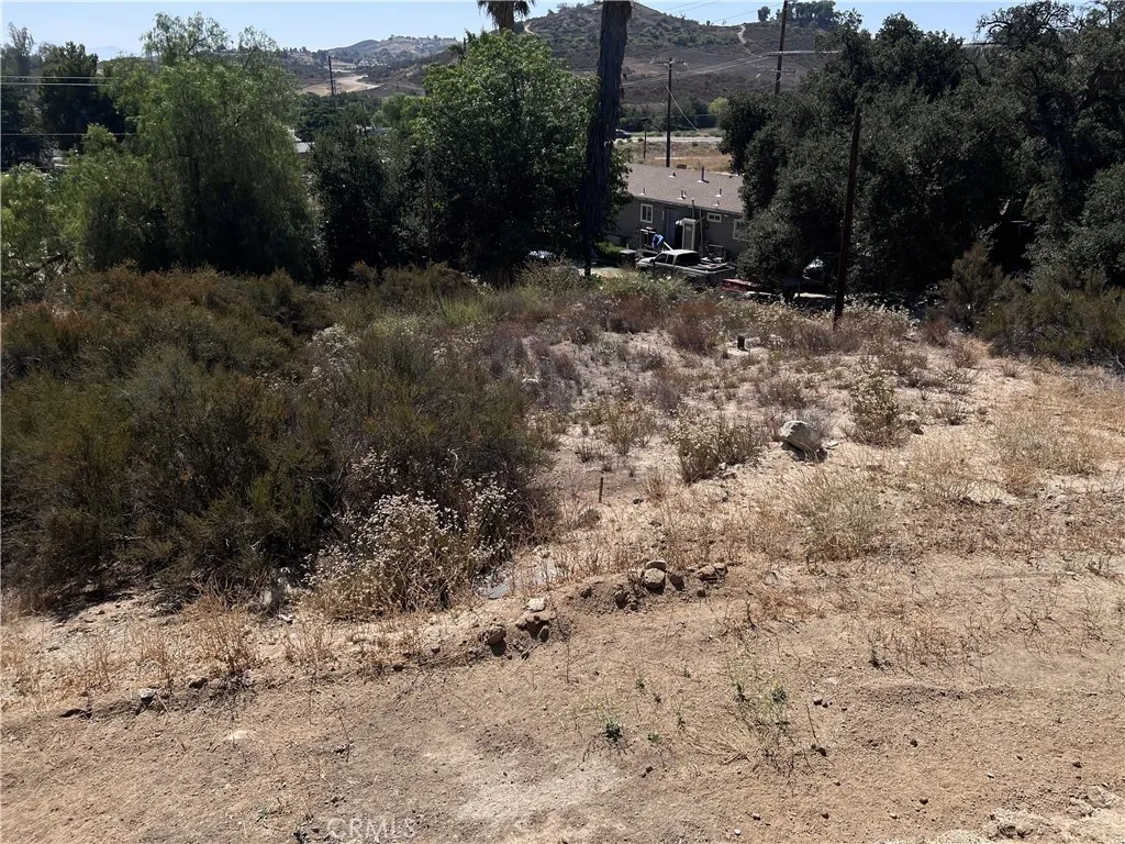 32962 West Wildomar, CA 92595 - Photo 3 of 9 a view of a dry yard with trees