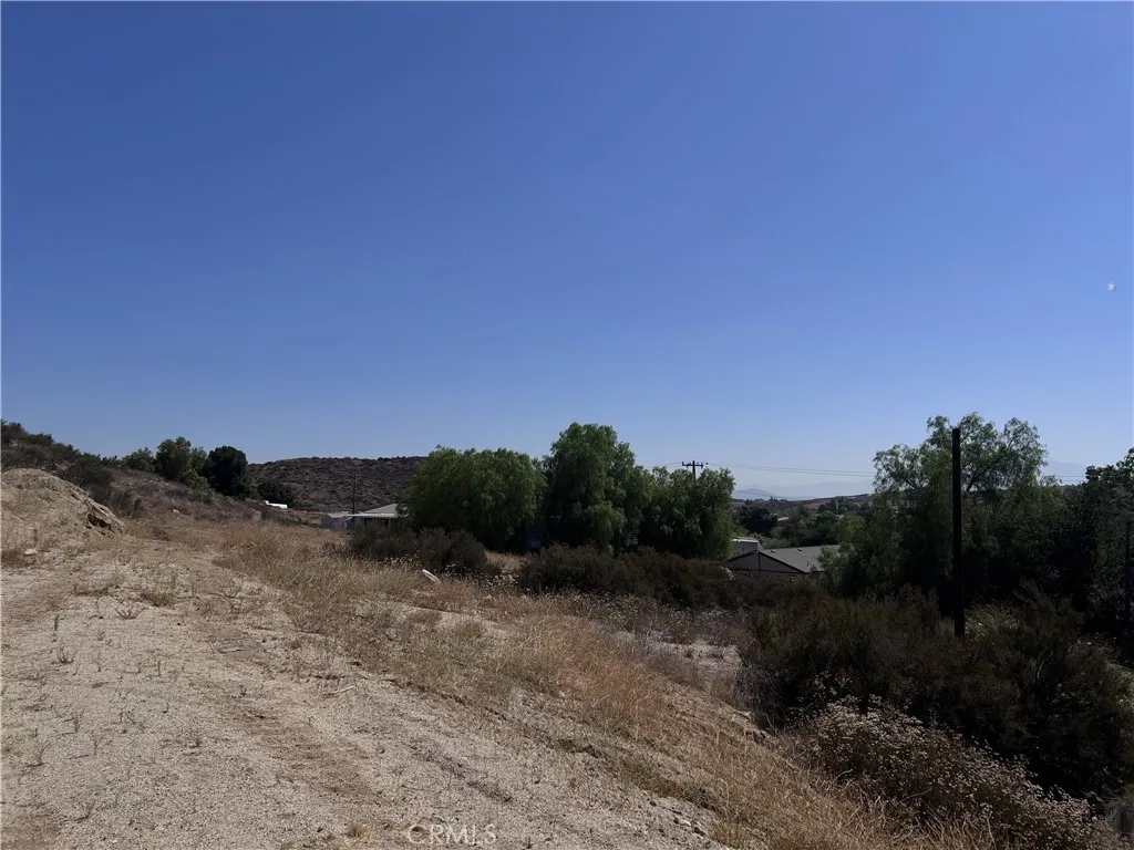 32962 West Wildomar, CA 92595 - Photo 9 of 9 a view of a dry yard with trees in the background