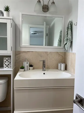 a bathroom with a sink and a toilet
