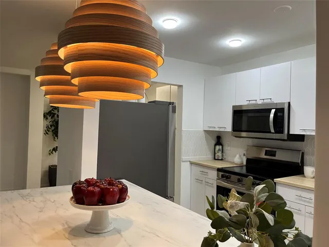 a bedroom with a bed and a television