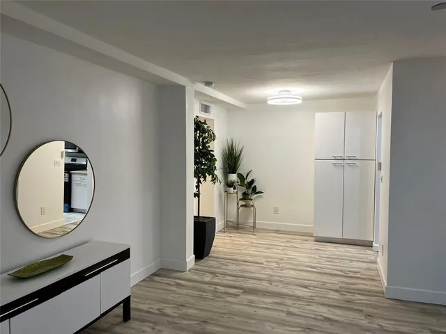 a view of a livingroom with wooden floor