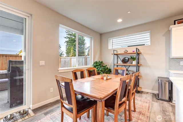 a view of a dining room with furniture window and outside view