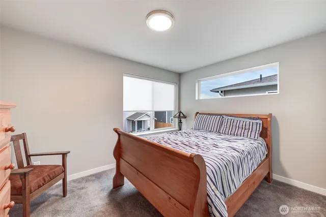 a bedroom with a bed and window