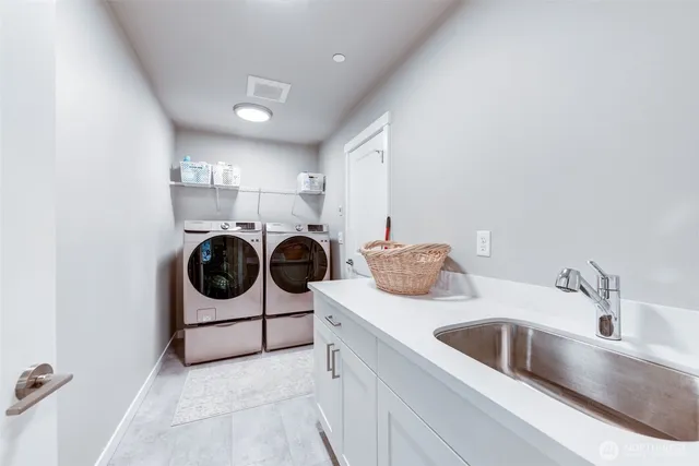 a view of a kitchen with washer and dryer