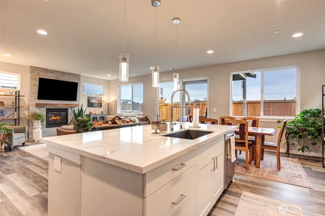 a large kitchen with a large counter top appliances and cabinets