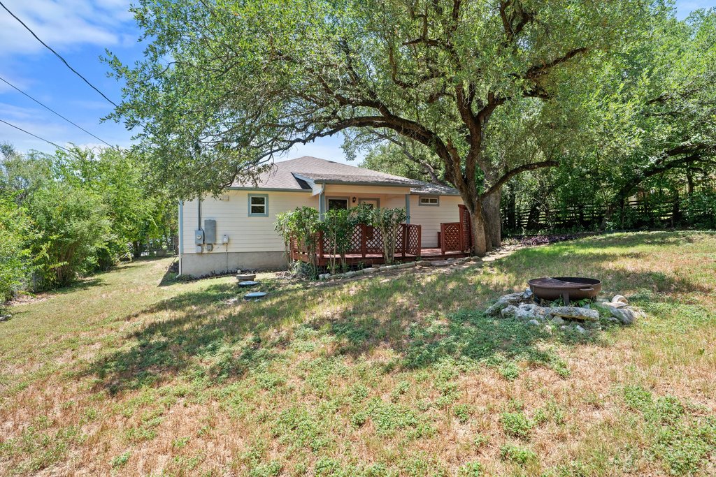 5208 Sioux Lane Austin, TX 78734 - Photo 31 of 35 A charming residence with a spacious deck and fire pit, ideal for outdoor gatherings.