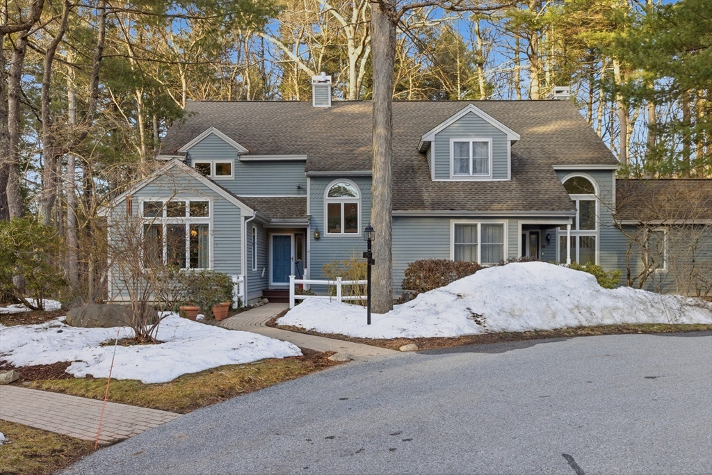 18 Quail Run, Unit 18 Acton, MA 01720 - Photo 1 of 23 a front view of a house with a yard