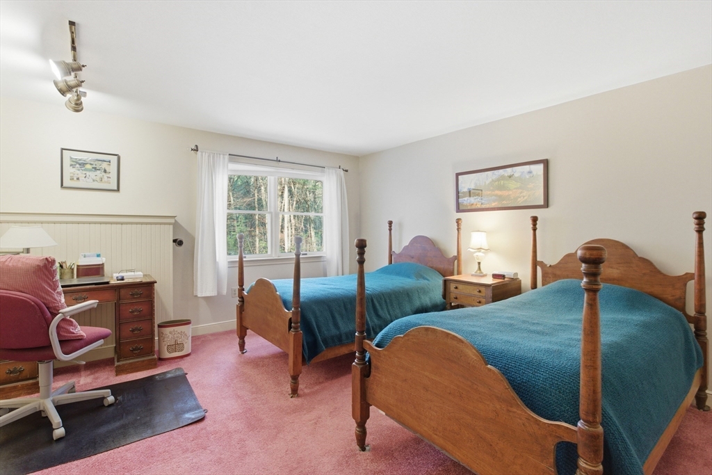 18 Quail Run, Unit 18 Acton, MA 01720 - Photo 13 of 23 a bedroom with furniture and a window