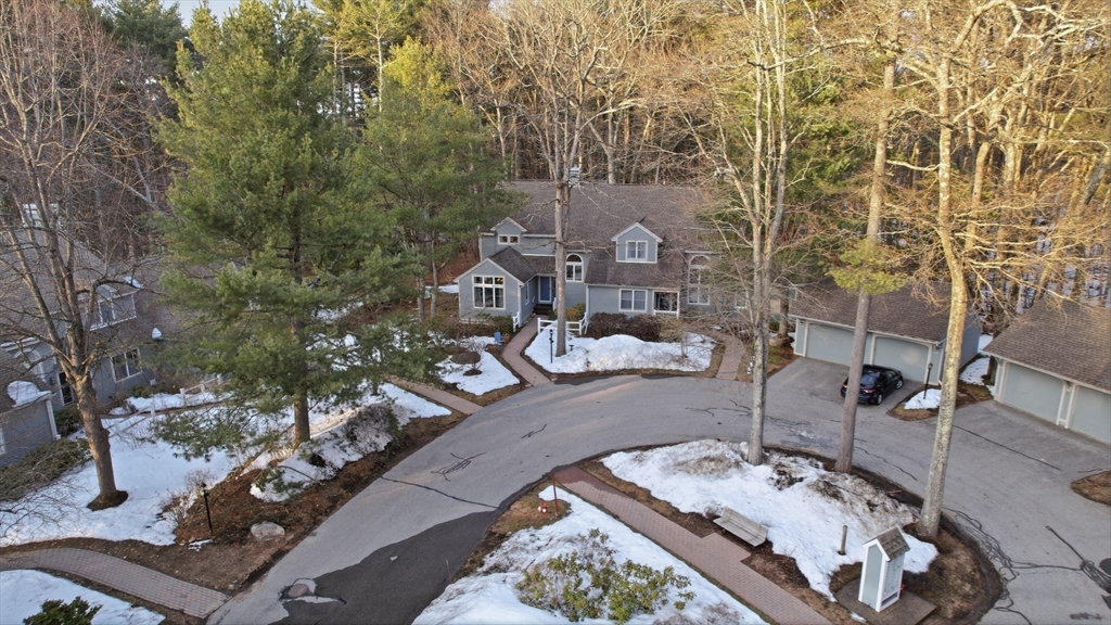 18 Quail Run, Unit 18 Acton, MA 01720 - Photo 20 of 23 a picture of table and chairs in the outdoor