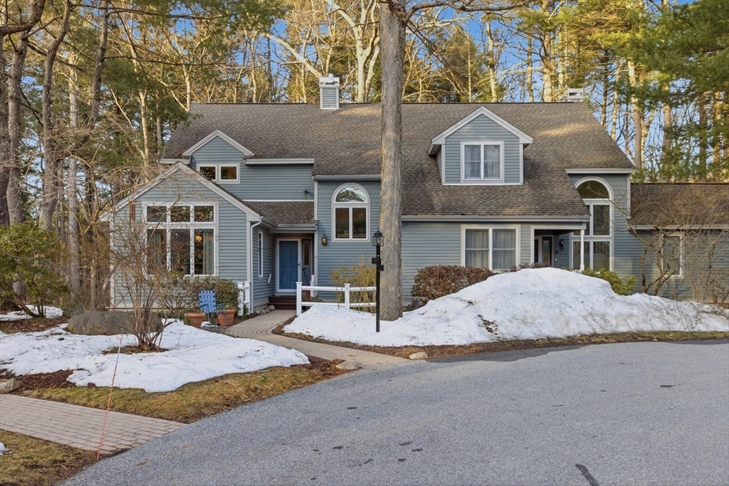 18 Quail Run, Unit 18 Acton, MA 01720 - Photo 2 of 23 a front view of a house with a yard