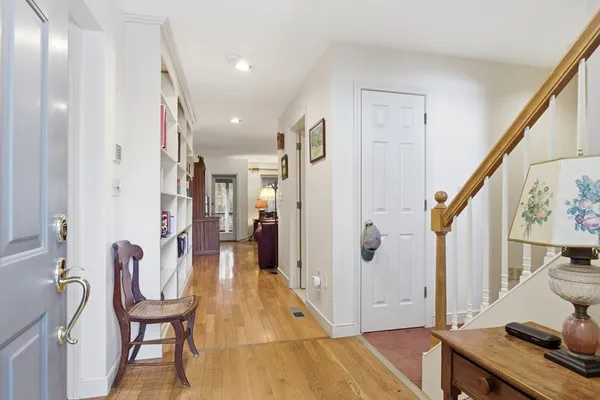 a view of a hallway with furniture and staircase
