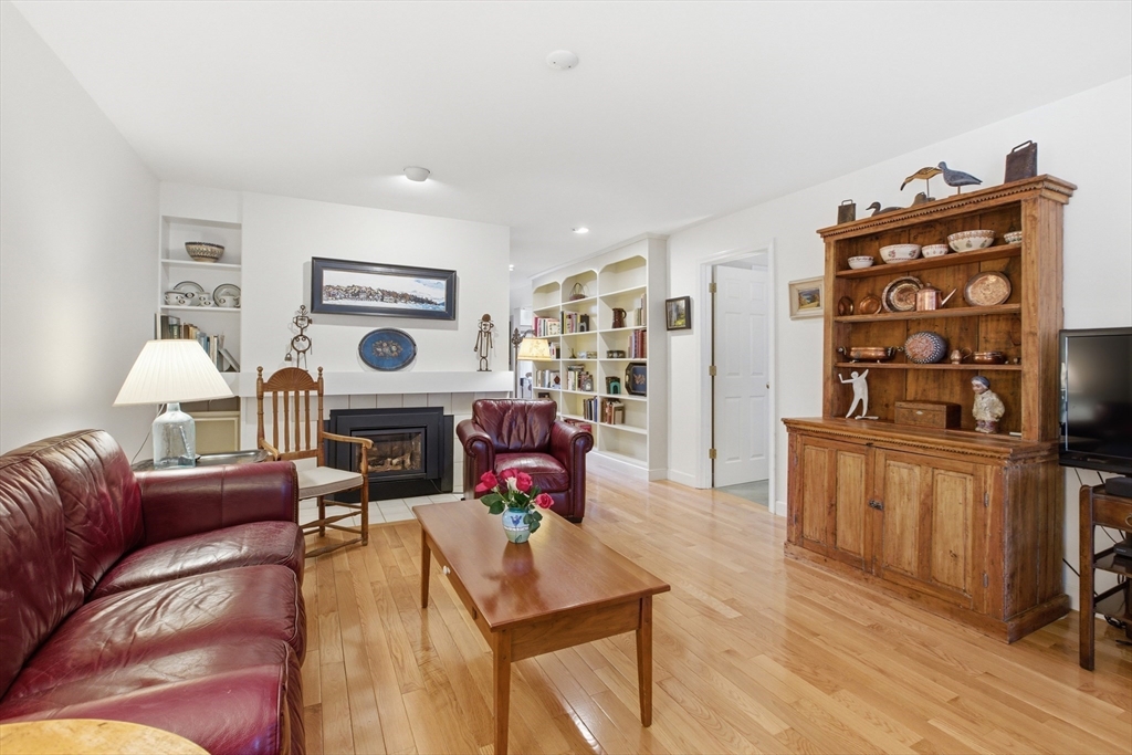 18 Quail Run, Unit 18 Acton, MA 01720 - Photo 6 of 23 a living room with furniture and wooden floor