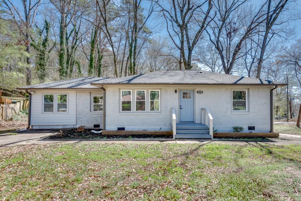front view of a house with a yard