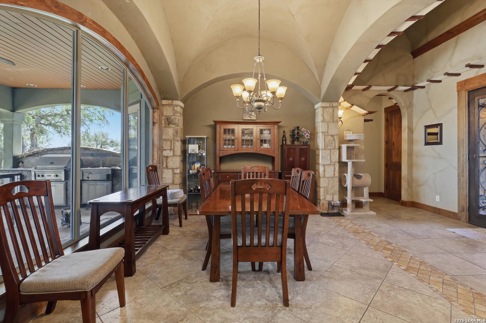 439 Mystic Parkway Spring Branch, TX 78070 - Photo 14 of 39 a view of a dining room with furniture a chandelier and large windows