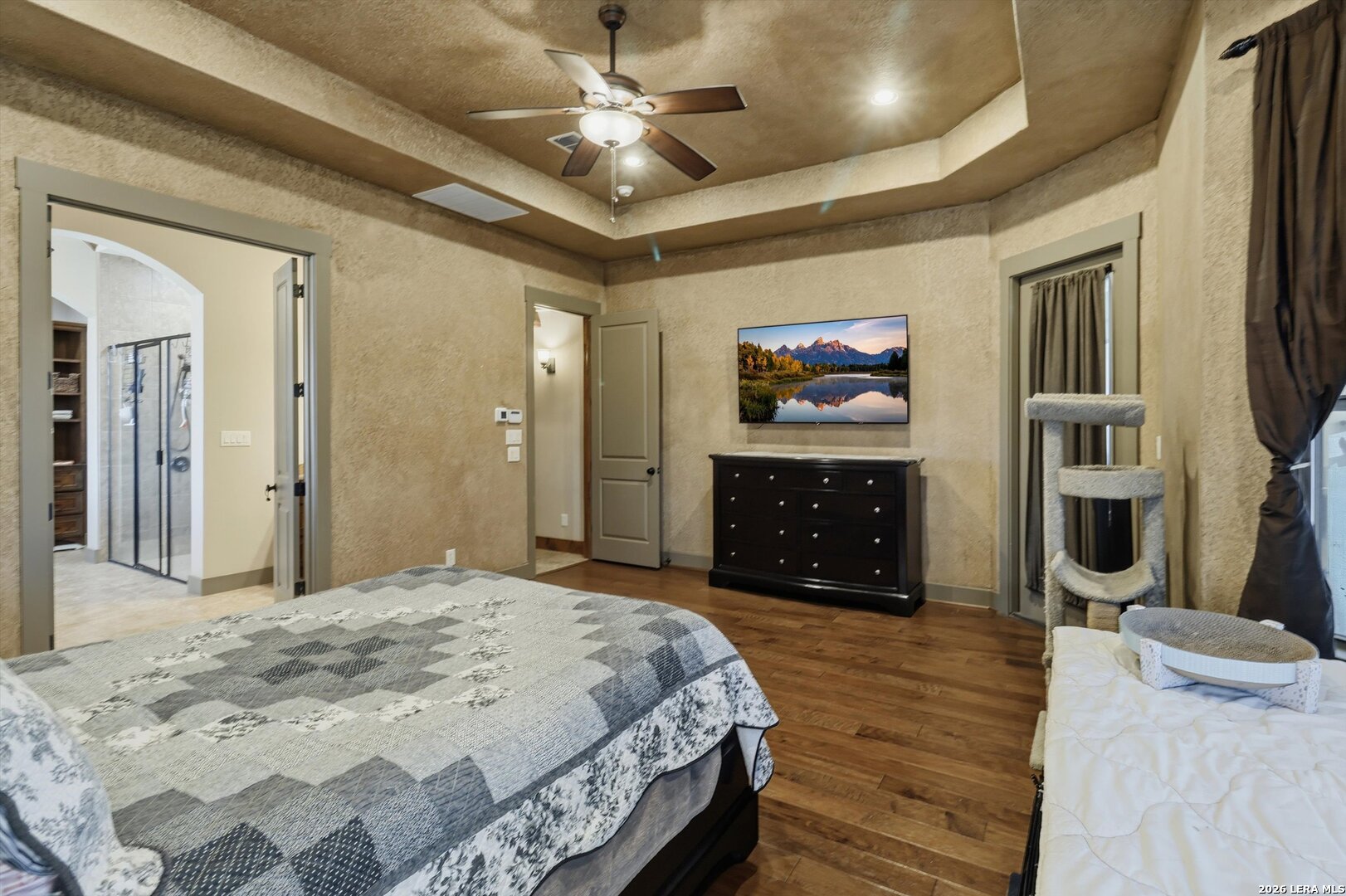 439 Mystic Parkway Spring Branch, TX 78070 - Photo 20 of 39 a spacious bedroom with a bed and a chandelier