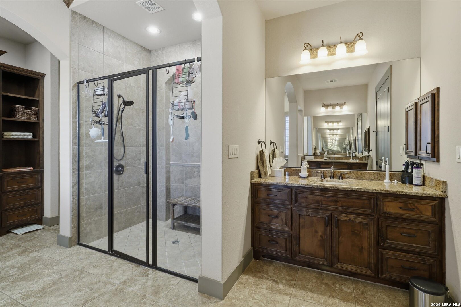 439 Mystic Parkway Spring Branch, TX 78070 - Photo 22 of 39 a bathroom with a shower sink and mirror