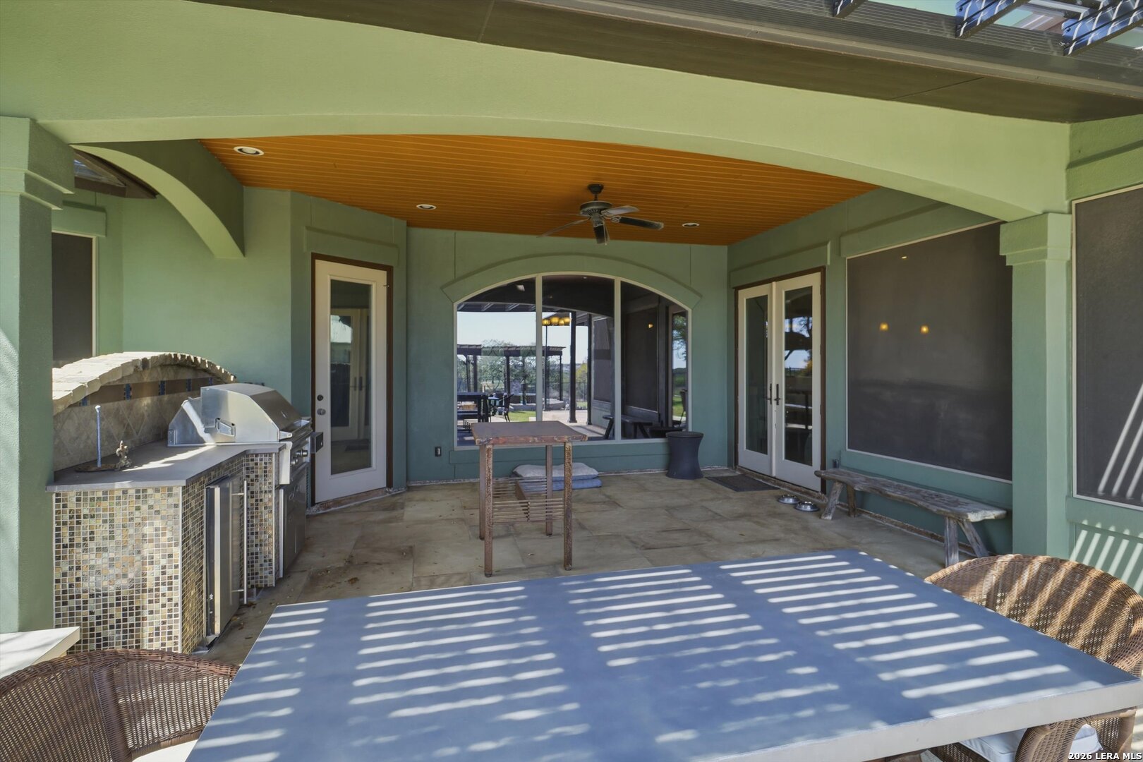 439 Mystic Parkway Spring Branch, TX 78070 - Photo 28 of 39 a view of a house with a chairs and table in a patio