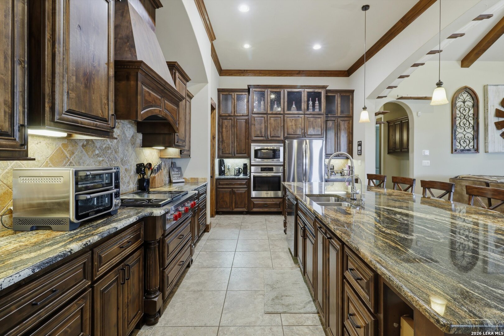 439 Mystic Parkway Spring Branch, TX 78070 - Photo 5 of 39 a large kitchen with stainless steel appliances granite countertop a large stove a sink and dishwasher
