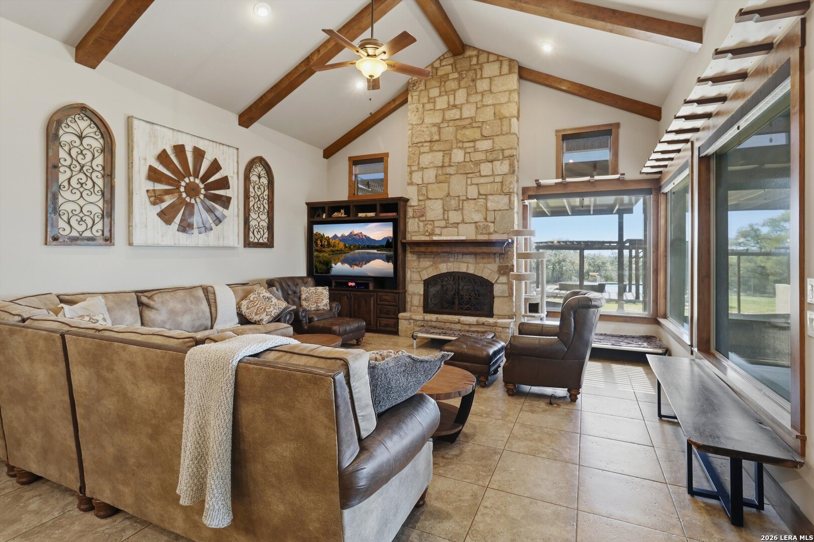 439 Mystic Parkway Spring Branch, TX 78070 - Photo 6 of 39 a living room with furniture a fireplace and a flat screen tv