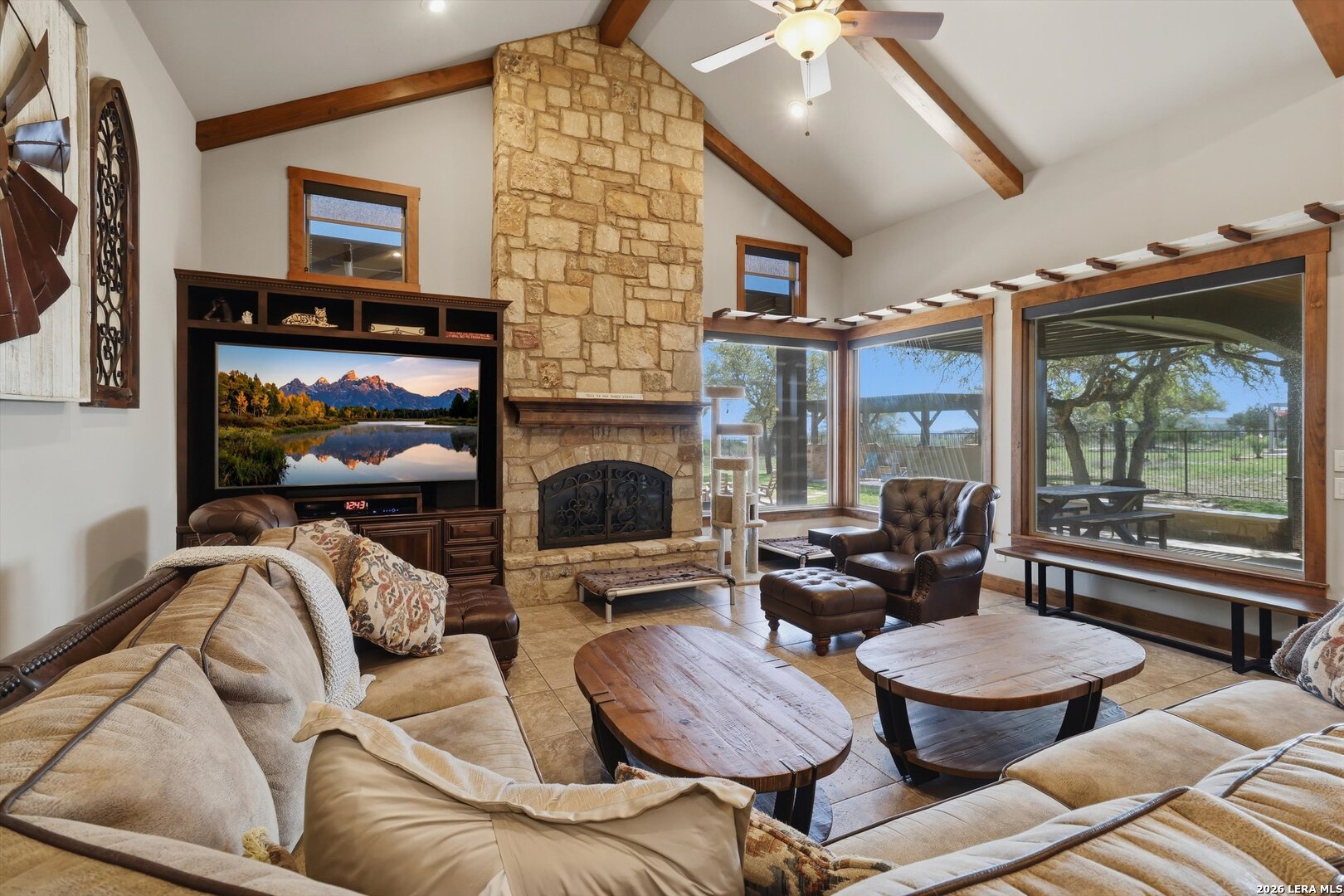 439 Mystic Parkway Spring Branch, TX 78070 - Photo 8 of 39 a living room with furniture a floor to ceiling window and a flat screen tv