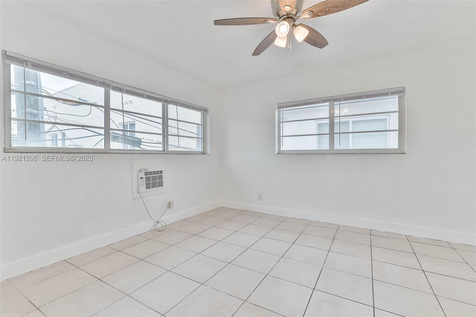 6921 Rue Vendome, Unit 1 Miami Beach, FL 33141 - Photo 11 of 27 a view of an empty room with a window