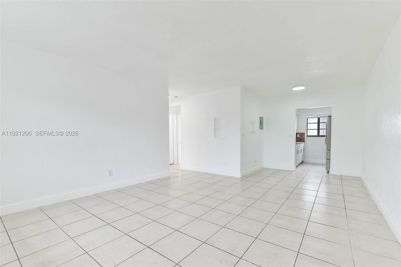 6921 Rue Vendome, Unit 1 Miami Beach, FL 33141 - Photo 2 of 27 a view of an empty room and window