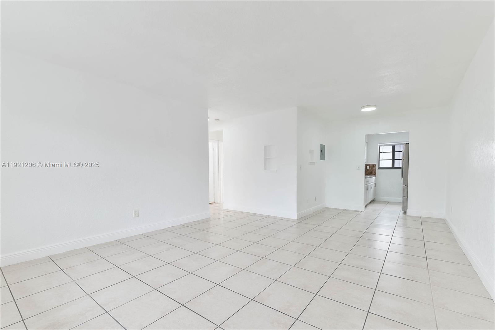 6921 Rue Vendome, Unit 1 Miami Beach, FL 33141 - Photo 2 of 23 a view of an empty room and window